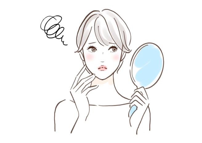 鏡を見る女性